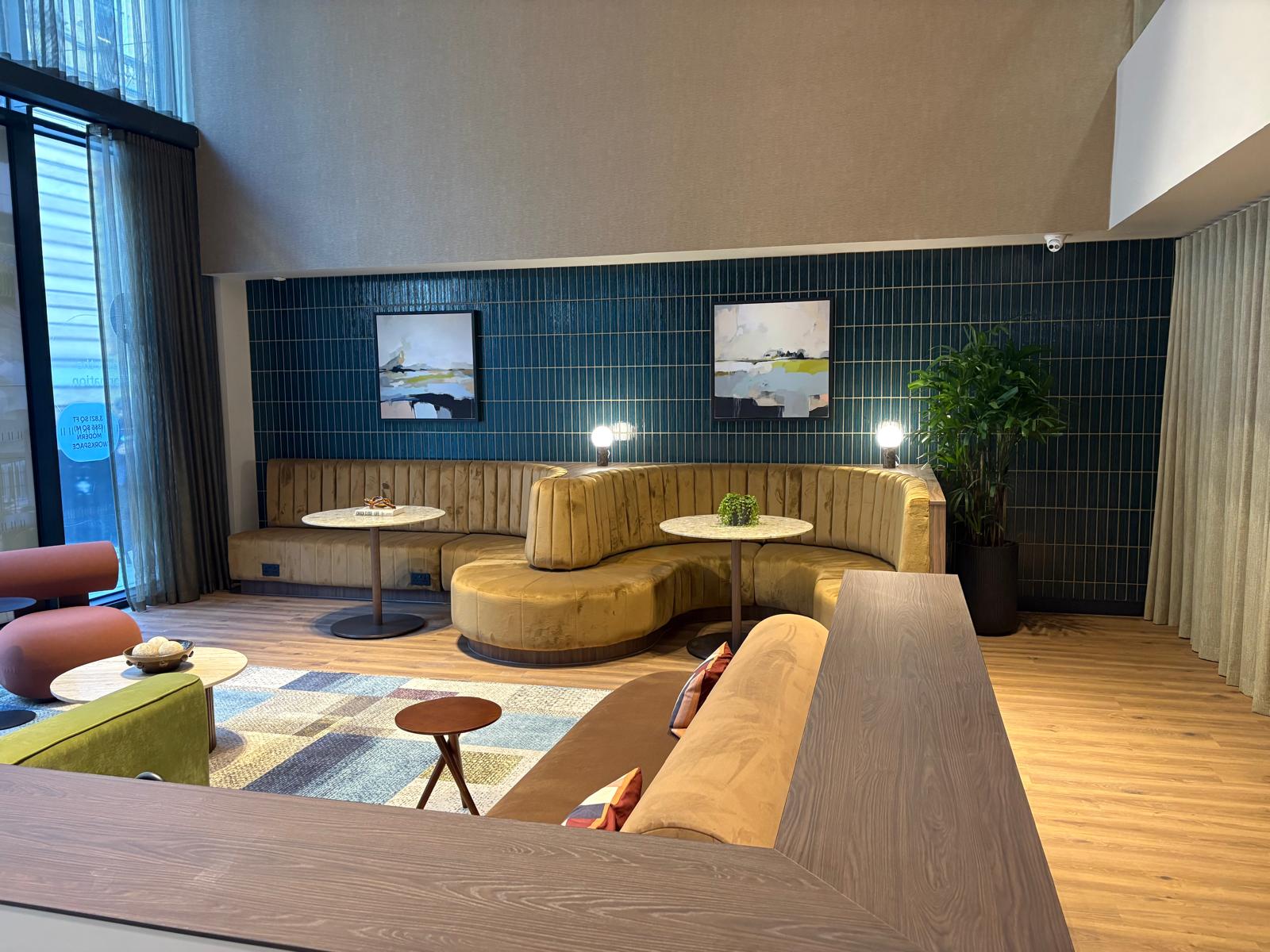 Commercial hotel lounge with teal tiled feature wall